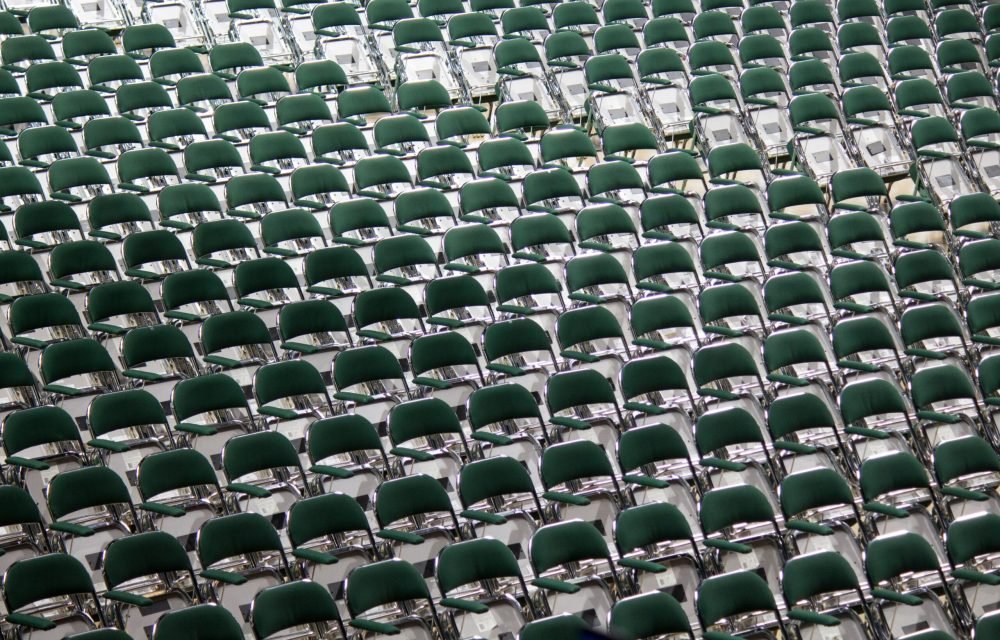 A wide shot of multiple chairs arranged in a row